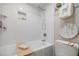 Bright bathroom with white subway tile, recessed shelf and soaking tub with wooden tray at 587 Virginia Ne Ave # 314, Atlanta, GA 30306