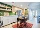 Well-appointed kitchen with stainless steel appliances, custom cabinets, open shelving, and green accent wall at 587 Virginia Ne Ave # 314, Atlanta, GA 30306