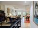 View from staircase to the living room and kitchen, featuring a modern open floor plan and natural light at 587 Virginia Ne Ave # 314, Atlanta, GA 30306