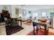 Bright living room with natural light, dining area, modern kitchen, vintage furniture, and unique decorative art at 587 Virginia Ne Ave # 314, Atlanta, GA 30306