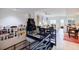 Open-concept living space featuring stairs, custom shelving, and hardwood floors, offering a seamless flow at 587 Virginia Ne Ave # 314, Atlanta, GA 30306