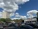 Parking lot with a view of Trader Joe's and a modern apartment building on a partly cloudy day at 587 Virginia Ne Ave # 314, Atlanta, GA 30306