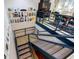 Multi-level staircase with custom shelving and modern design, adding architectural interest to the home at 587 Virginia Ne Ave # 314, Atlanta, GA 30306