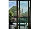 Balcony showcasing a picturesque view of the city skyline and vibrant green trees at 587 Virginia Ne Ave # 314, Atlanta, GA 30306