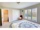 Comfortable bedroom with natural light, neutral colors, and ample closet space at 610 Loth Wages Rd, Dacula, GA 30019