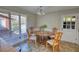 Bright dining area with natural light, traditional furniture, and tile flooring at 610 Loth Wages Rd, Dacula, GA 30019