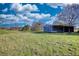 A vast land with a simple outbuilding on it, perfect for outdoor activities and enjoying nature's beauty at 610 Loth Wages Rd, Dacula, GA 30019
