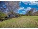 Open lot with a storage building, set in a serene and expansive environment, ideal for various uses at 610 Loth Wages Rd, Dacula, GA 30019