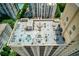 Aerial view of rooftop amenity space with lounge chairs and dining sets at 1101 Juniper Ne St # 632, Atlanta, GA 30309