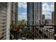 Building view from balcony with potted plants and black metal railing at 1101 Juniper Ne St # 632, Atlanta, GA 30309