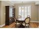 Charming dining area with dark wood furniture and plantation shutters at 1101 Juniper Ne St # 632, Atlanta, GA 30309