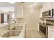 Bright kitchen featuring stainless steel appliances, granite countertops, and modern track lighting at 1101 Juniper Ne St # 632, Atlanta, GA 30309