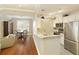 Bright kitchen with white cabinets, stainless steel appliances, granite countertops, and wood flooring at 1101 Juniper Ne St # 632, Atlanta, GA 30309