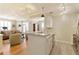Open concept living area featuring a kitchen island, hardwood floors, neutral tones and ample seating at 1101 Juniper Ne St # 632, Atlanta, GA 30309