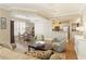 Inviting living room featuring stylish seating, rich wood floors, shutters, and decorative accents at 1101 Juniper Ne St # 632, Atlanta, GA 30309