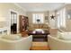 Comfortable living room with hardwood floors, a plush sofa, and shuttered windows creating an inviting space at 1101 Juniper Ne St # 632, Atlanta, GA 30309