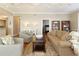 Open living room with hardwood floors, plush seating, neutral decor and an open doorway at 1101 Juniper Ne St # 632, Atlanta, GA 30309