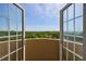 Private balcony with incredible views of lush green trees and blue skies at 2161 Peachtree Ne Rd # 907, Atlanta, GA 30309