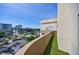 Balcony view features a city view with a mix of high-rise buildings and lush greenery at 2161 Peachtree Ne Rd # 907, Atlanta, GA 30309