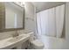 Bathroom featuring a white sink, toilet, and bathtub with shower at 2161 Peachtree Ne Rd # 907, Atlanta, GA 30309