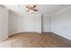 Bright bedroom features herringbone floors and a ceiling fan at 2161 Peachtree Ne Rd # 907, Atlanta, GA 30309