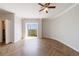 Spacious bedroom with wood floors, ceiling fan, and access to a private balcony at 2161 Peachtree Ne Rd # 907, Atlanta, GA 30309