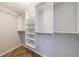 Walk-in closet with multiple shelves and hanging rods at 2161 Peachtree Ne Rd # 907, Atlanta, GA 30309