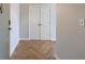 Entryway featuring wood-look flooring in a herringbone pattern and clean, neutral walls at 2161 Peachtree Ne Rd # 907, Atlanta, GA 30309