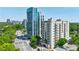 Exterior shot of luxurious apartment complex with modern architecture and lush greenery in the background at 2161 Peachtree Ne Rd # 907, Atlanta, GA 30309