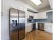 Contemporary kitchen with stainless steel appliances and white cabinets, flooded with natural light at 2161 Peachtree Ne Rd # 907, Atlanta, GA 30309