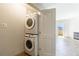 Laundry room features stackable washer and dryer at 2161 Peachtree Ne Rd # 907, Atlanta, GA 30309