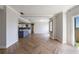 Living room features kitchen view, herringbone floors and balcony with city view at 2161 Peachtree Ne Rd # 907, Atlanta, GA 30309