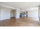 Spacious living room featuring herringbone floors and open access to a modern kitchen at 2161 Peachtree Ne Rd # 907, Atlanta, GA 30309
