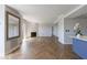 Open-concept living room boasting herringbone floors, fireplace, and a stylish color palette at 2161 Peachtree Ne Rd # 907, Atlanta, GA 30309