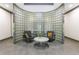 Comfortable seating area in the lobby, with a glass block wall and stylish accents at 2161 Peachtree Ne Rd # 907, Atlanta, GA 30309