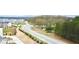 A well-planned community with modern homes, green spaces, and convenient road access showcasing a desirable lifestyle at 4209 Tifton Ln, Sugar Hill, GA 30518