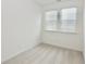 Well-lit bedroom with plush carpeting and two large windows at 4209 Tifton Ln, Sugar Hill, GA 30518