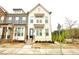 Charming brick townhome with a welcoming entrance, neat landscaping, and a sidewalk at 4209 Tifton Ln, Sugar Hill, GA 30518