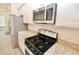 Modern kitchen with stainless steel appliances, white cabinetry, and granite countertops at 4209 Tifton Ln, Sugar Hill, GA 30518