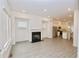 Open-concept living area featuring modern flooring, ample natural light, and seamless flow to the kitchen at 4209 Tifton Ln, Sugar Hill, GA 30518