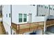 A raised wood deck attached to a townhome, offering private outdoor space with a view to the side at 4209 Tifton Ln, Sugar Hill, GA 30518
