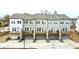 Townhomes with private decks and garages create an inviting and functional living space with a modern feel at 4209 Tifton Ln, Sugar Hill, GA 30518