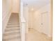 Carpeted staircase in a well-lit, modern home at 4209 Tifton Ln, Sugar Hill, GA 30518
