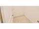 A compact walk-in closet, showcasing new carpet and a simple shelf perfect for organized storage at 4209 Tifton Ln, Sugar Hill, GA 30518