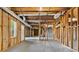 Unfinished basement space with visible framework, ductwork, and a window at 5485 Woodrun Ln, Johns Creek, GA 30005