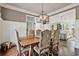 Elegant dining room leading to a bright, modern kitchen at 5485 Woodrun Ln, Johns Creek, GA 30005
