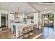 Bright kitchen featuring a large center island with seating, stainless steel appliances, and wine storage at 5485 Woodrun Ln, Johns Creek, GA 30005