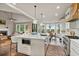 Bright, open kitchen with a large island, modern appliances, and a breakfast nook at 5485 Woodrun Ln, Johns Creek, GA 30005
