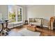 Sitting room featuring hardwood floors, lots of light, and neutral decor at 5485 Woodrun Ln, Johns Creek, GA 30005