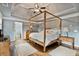 Main bedroom features a four-poster bed, hardwood floors, tray ceiling, and ensuite bathroom at 5485 Woodrun Ln, Johns Creek, GA 30005